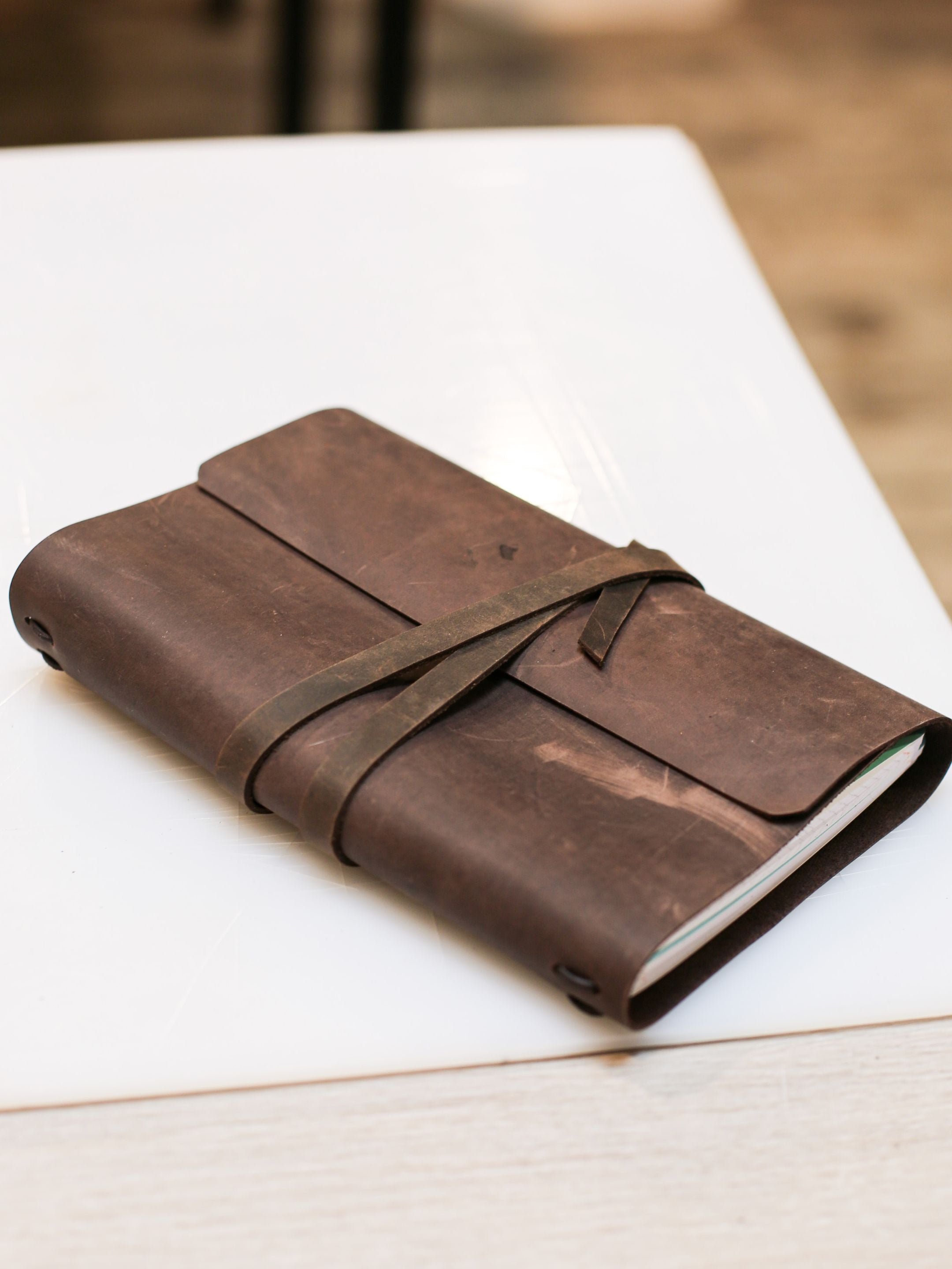 Leather journal making class in Tbilisi — a group workshop for friends and families at the Qisa studio
