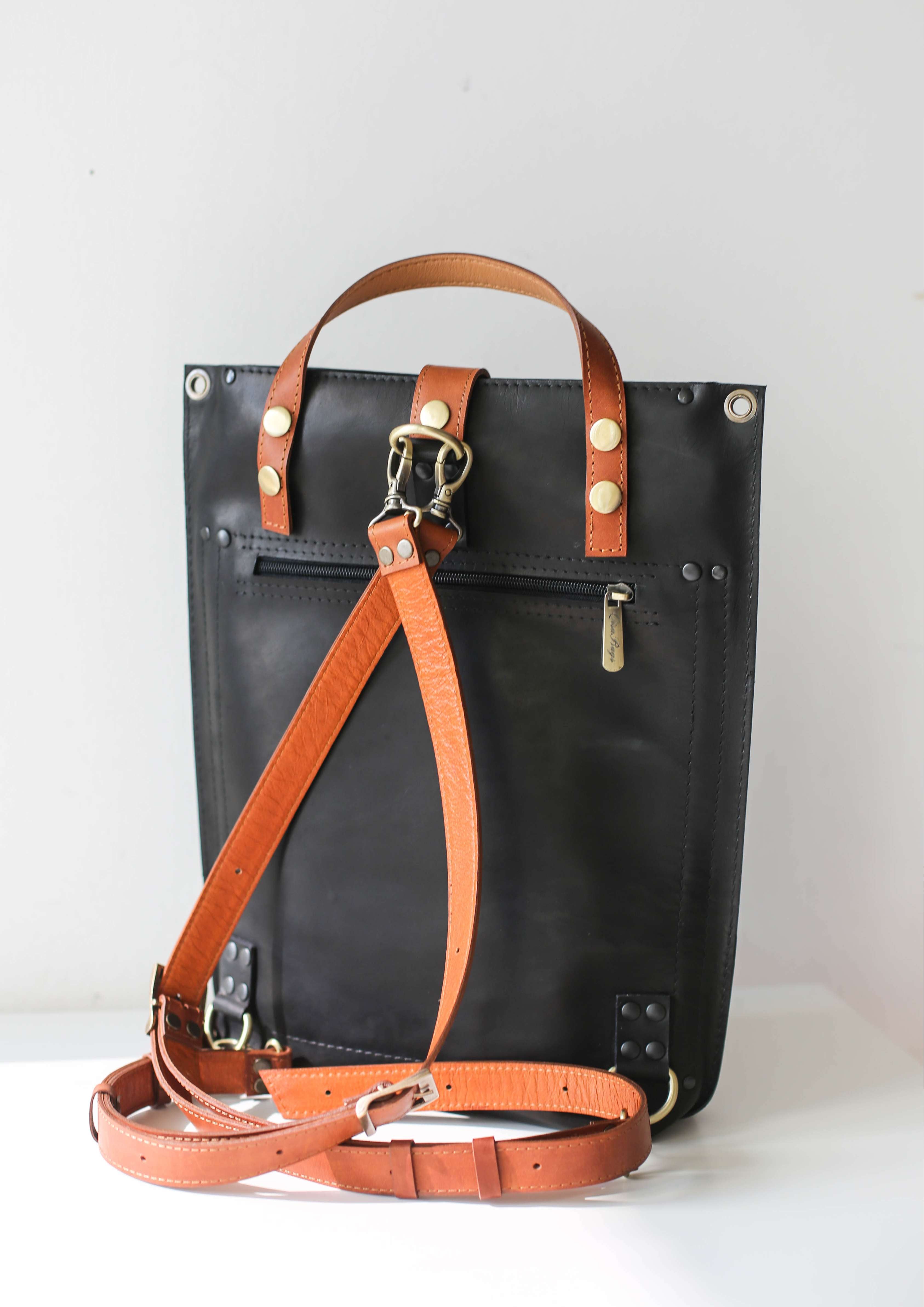 black leather purse with pockets