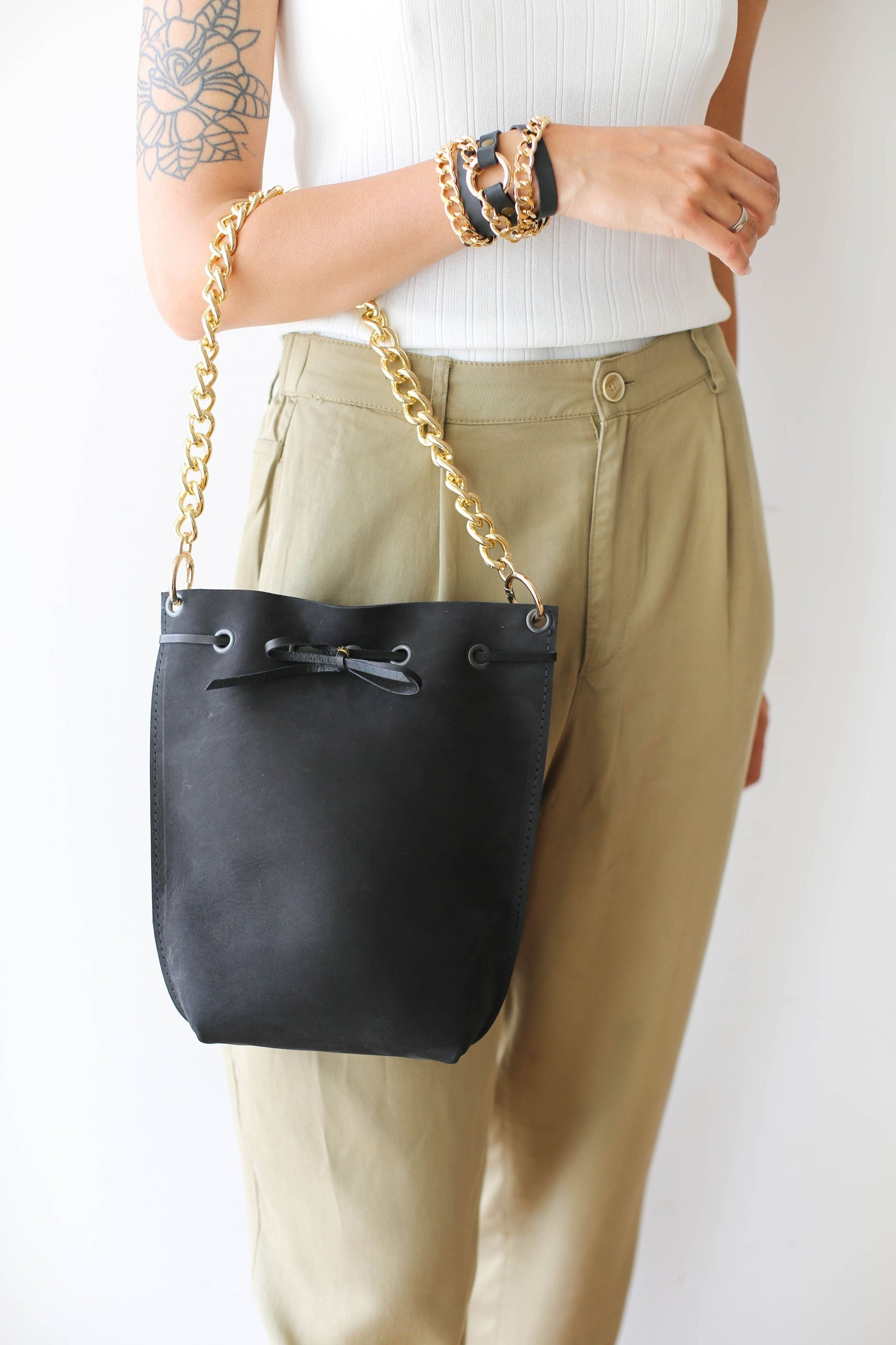 Black leather bucket bag with chain strap