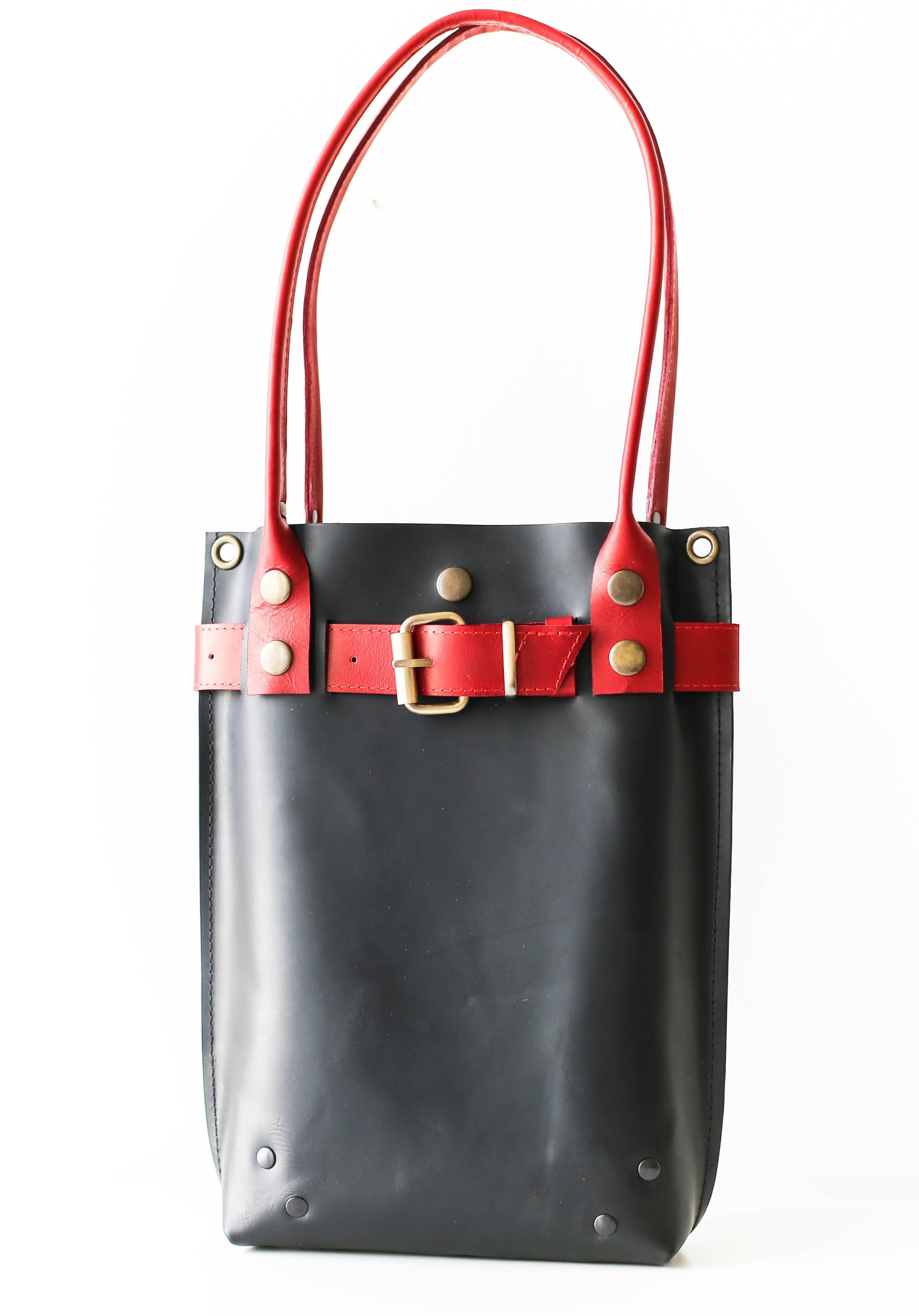 Black leather bag with red online interior