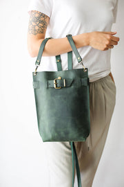 green leather purse backpack