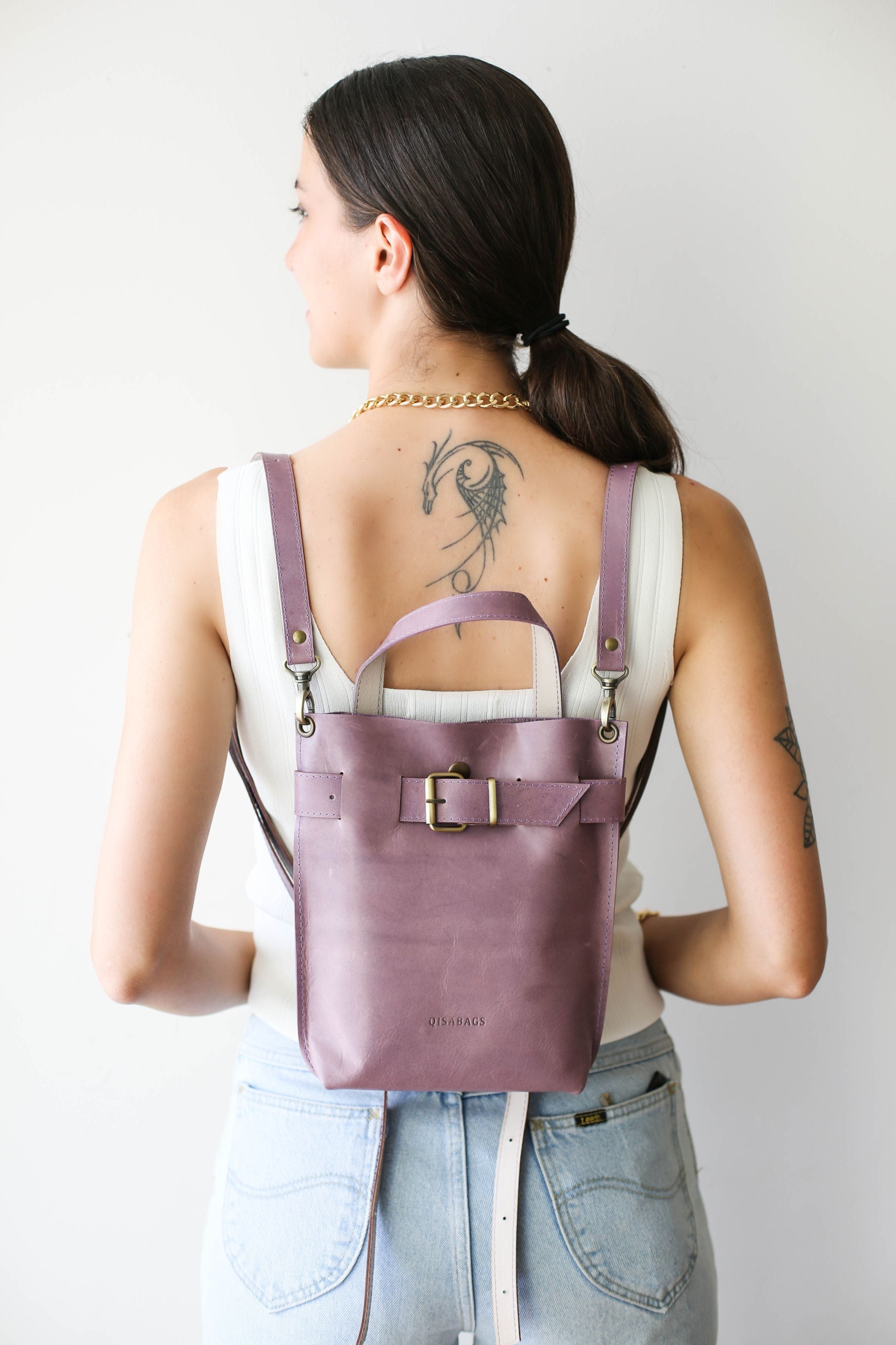 Purple leather backpack sales purse