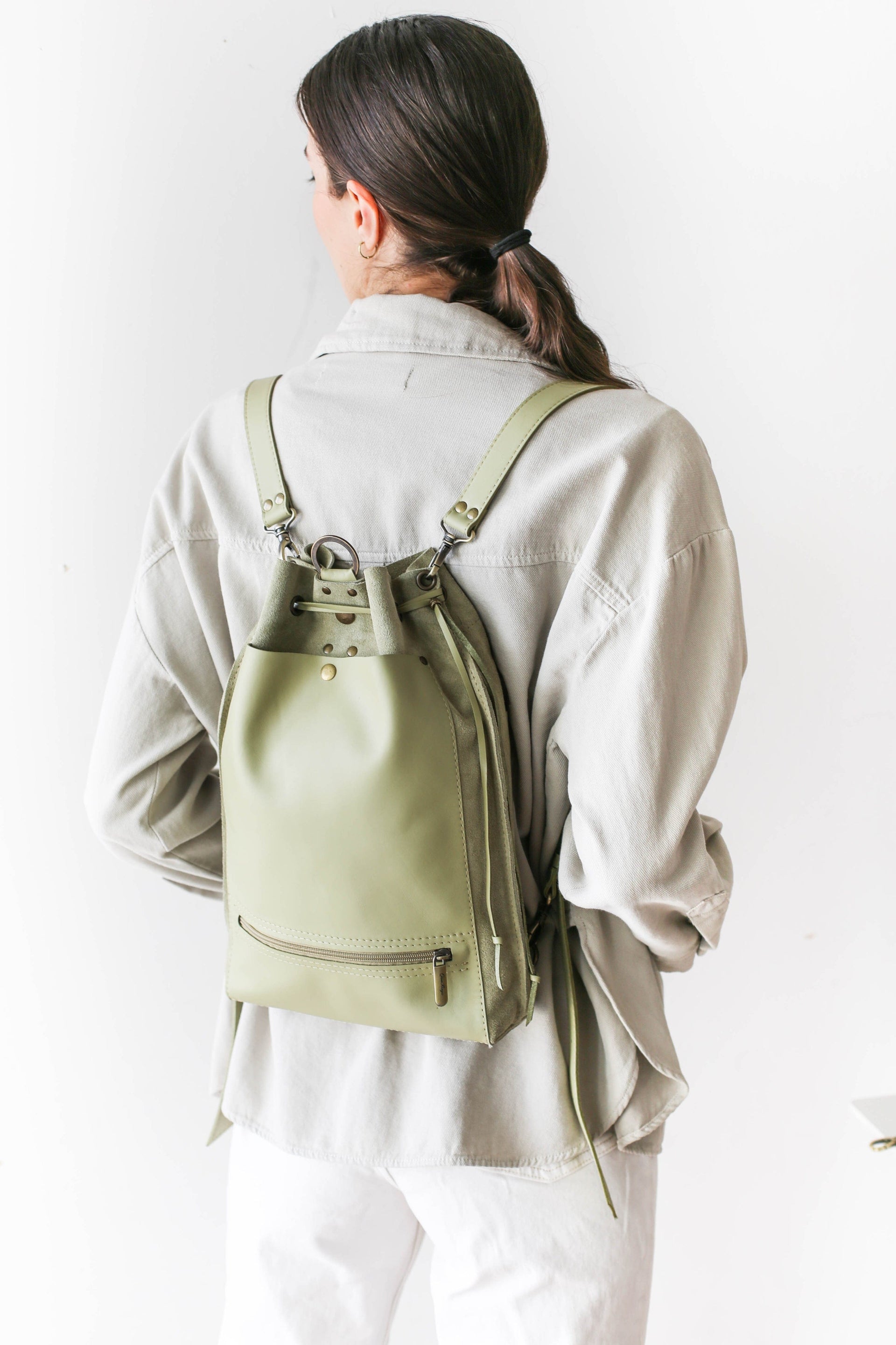 green leather backpack