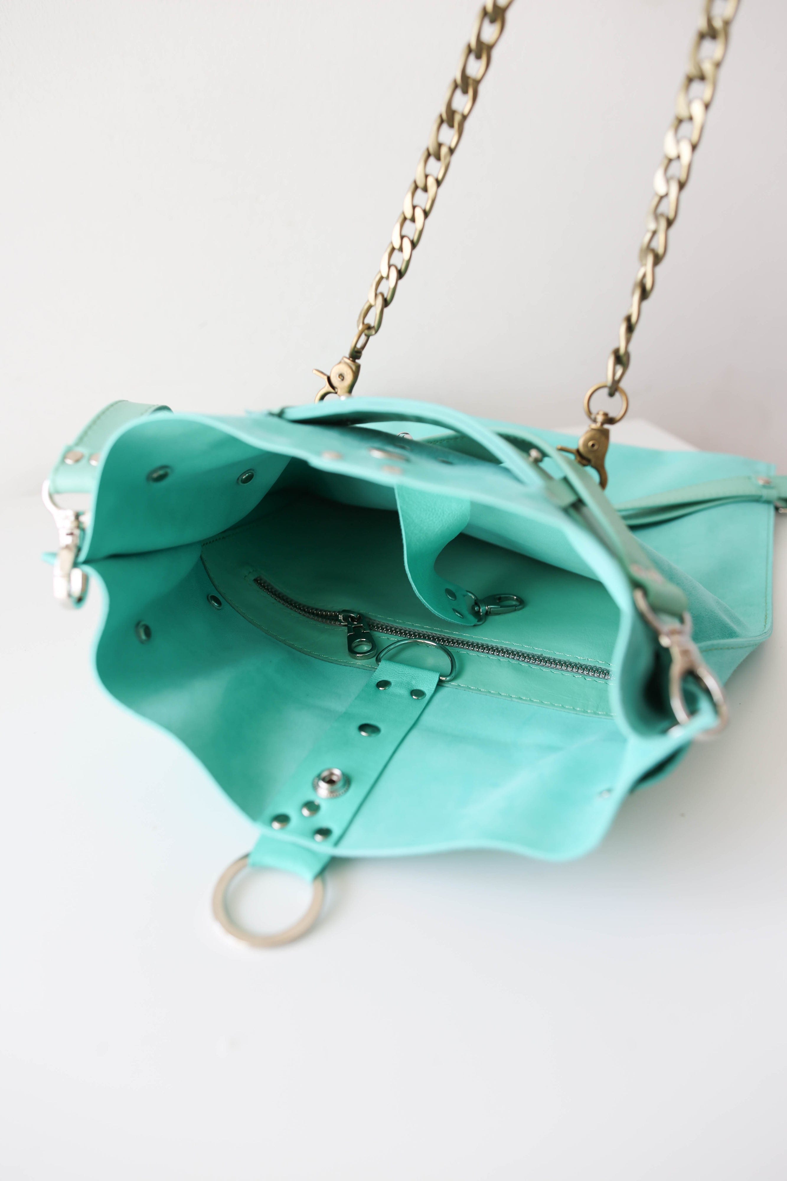 Turquoise designer bag sale